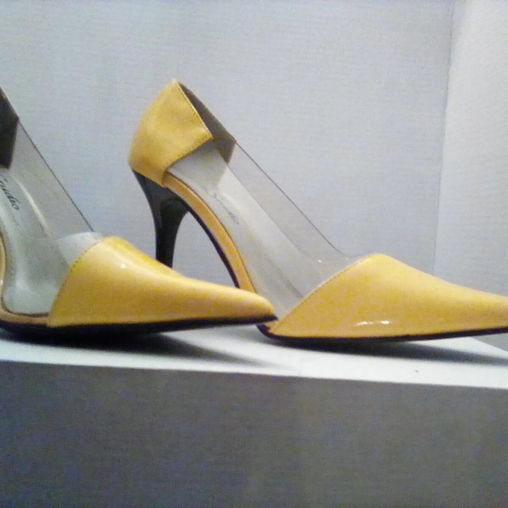 Bright yellow and clear pointy toe pumps. Great springtime shoes! Unworn.